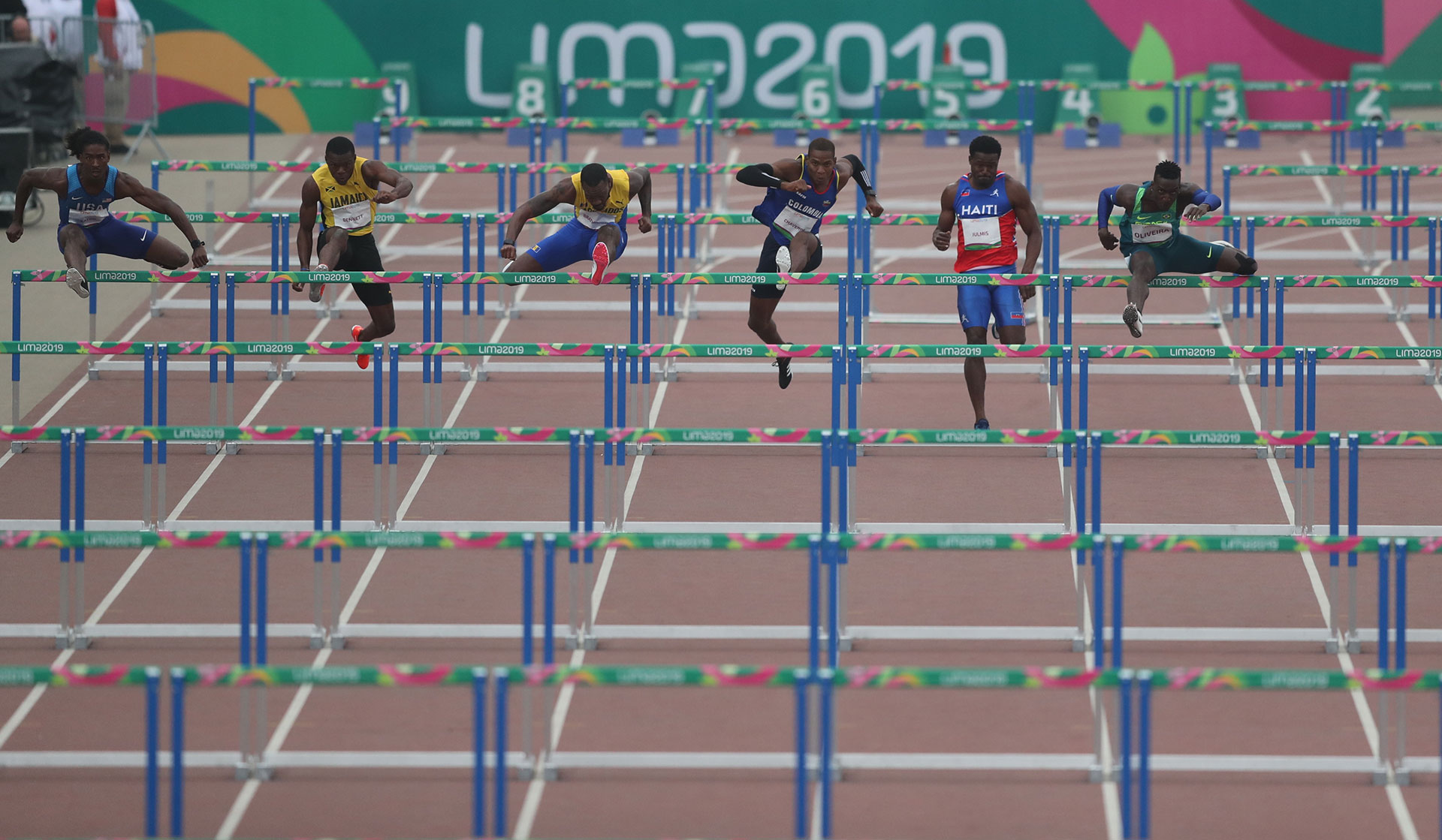 XVIII Pan American Games - Lima 2019 XVIII Pan American Games - Lima 2019 - Athletics - Men's 110m Hurdles Semifinal 2/2 - Athletics Stadium, Lima, Peru - August 9, 2019. Jarret Eaton of the U.S., Jamaica's Orlando Bennett, Barbado's Shane Brathwaite, Colombia's Yojan Chaverra, Haiti's Jeffrey Julmis and Brazil's Gabriel Oliveira in action. REUTERS/Ivan Alvarado