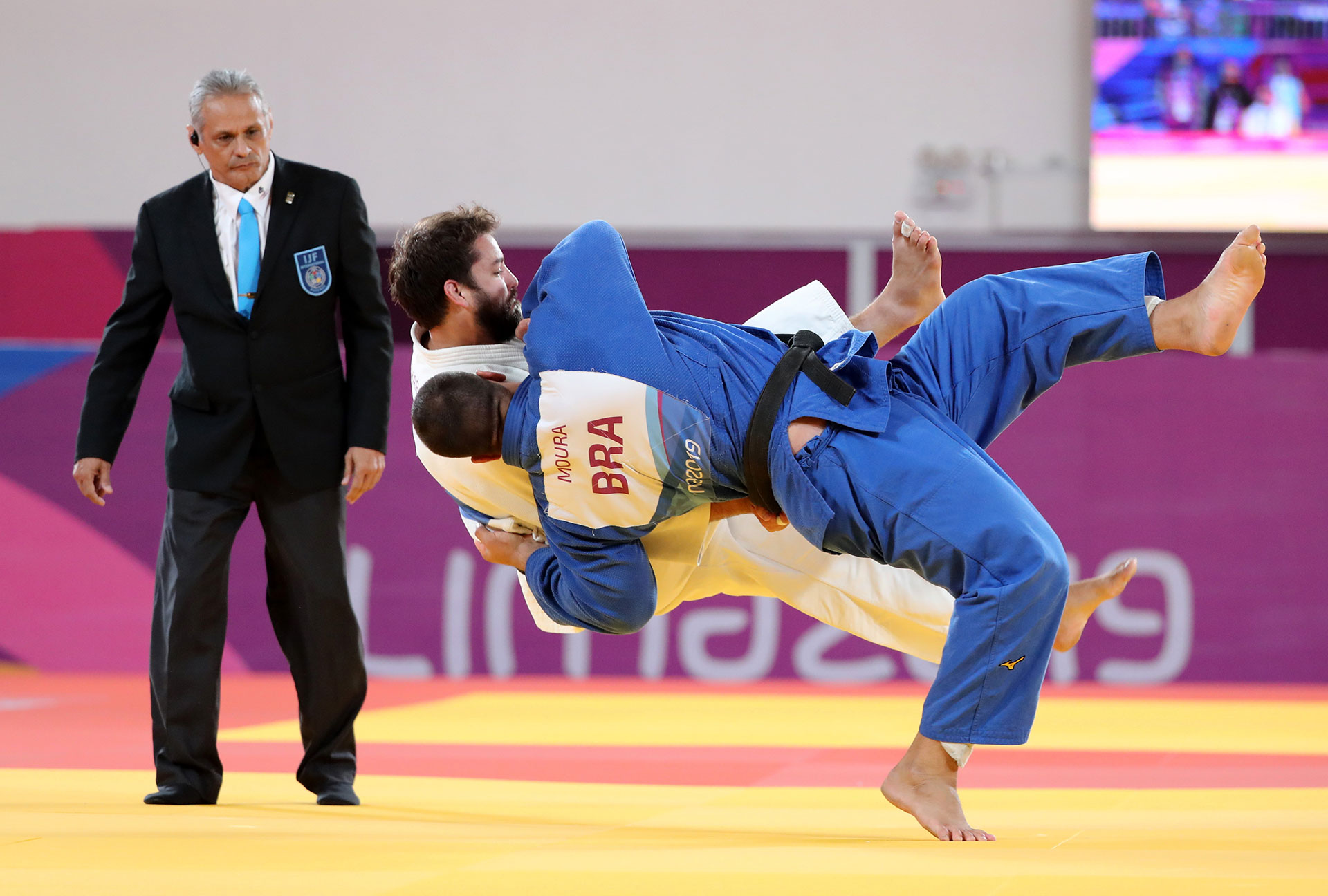 XVIII Pan American Games - Lima 2019 XVIII Pan American Games - Lima 2019 - Judo - Men's +100 kg Bronze Medal Match - Villa Deportiva Nacional, Videna, Lima, Peru - August 11, 2019 Ajax Tadehara of the U.S. and Brazil's David Moura in action. REUTERS/Sergio Moraes