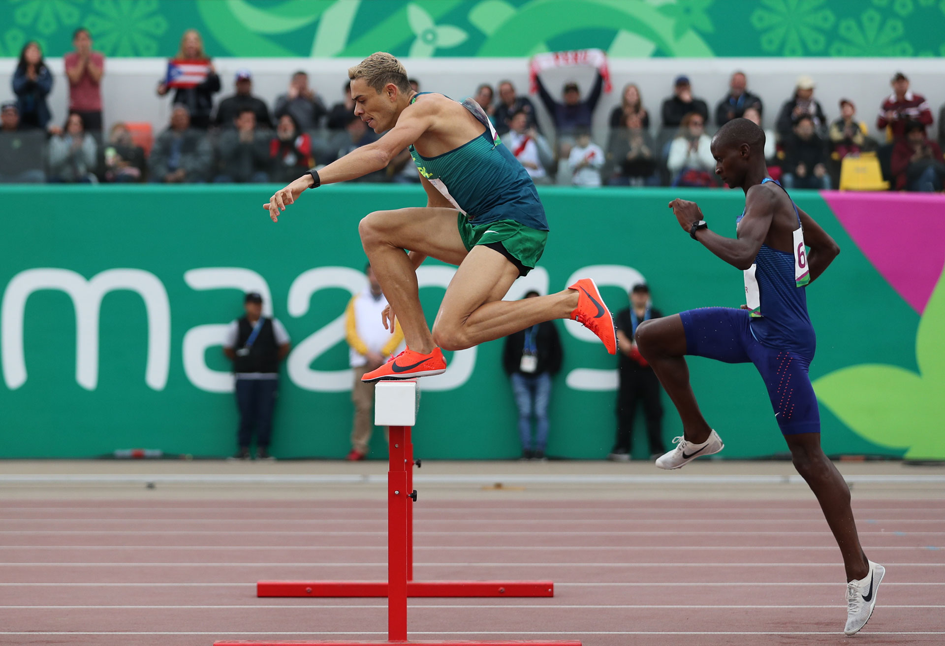 XVIII Pan American Games - Lima 2019 XVIII Pan American Games - Lima 2019 - Athletics - Men's 3000m Steeplechase Final - Athletics Stadium, Lima, Peru - August 10, 2019. Brazil's Altobeli Santos and Benard Keter of the U.S. in action. REUTERS/Ivan Alvarado