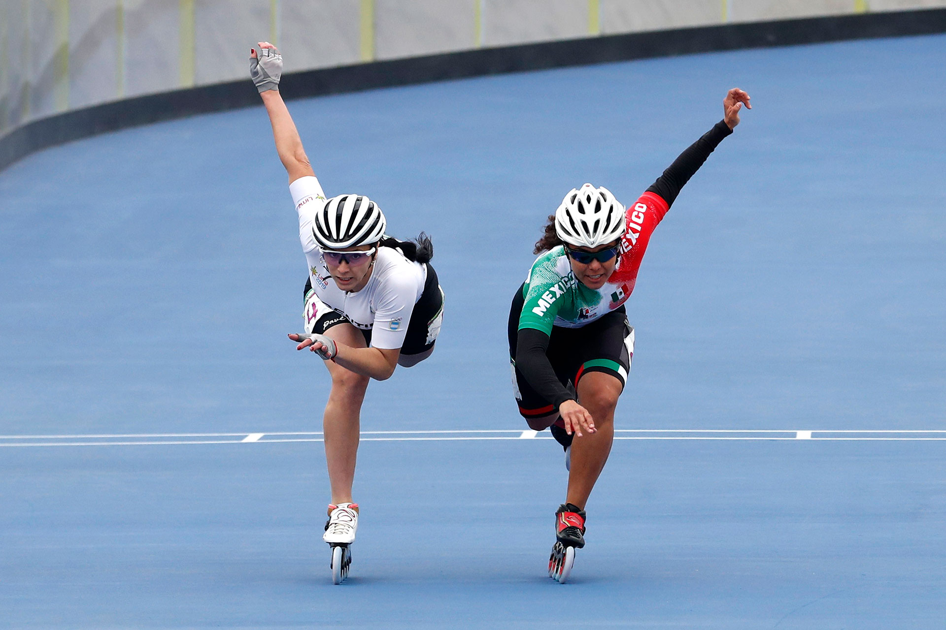 XVIII Pan American Games - Lima 2019 XVIII Pan American Games - Lima 2019 - Roller Speed Skating - Women's 500m + Distance Semifinal - Costa Verde Skating Ring, Lima, Peru - August 10, 2019. Mexico's Veronica Aracel Elias Alvarado and Argentina's Maria Rodriguez Lopez in action. REUTERS/Susana Vera